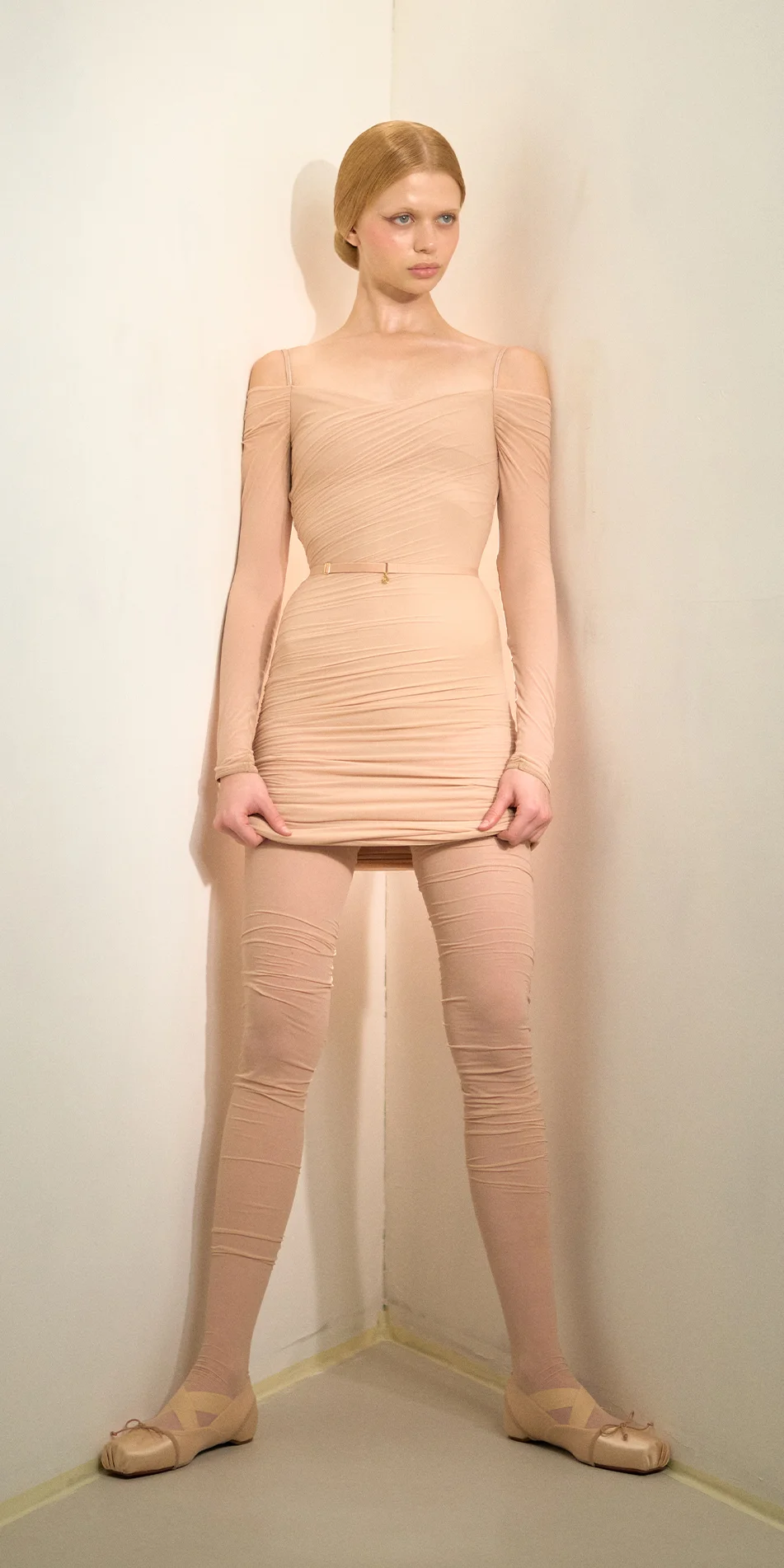 Sheer bodycon midi dress in light beige front leaning back