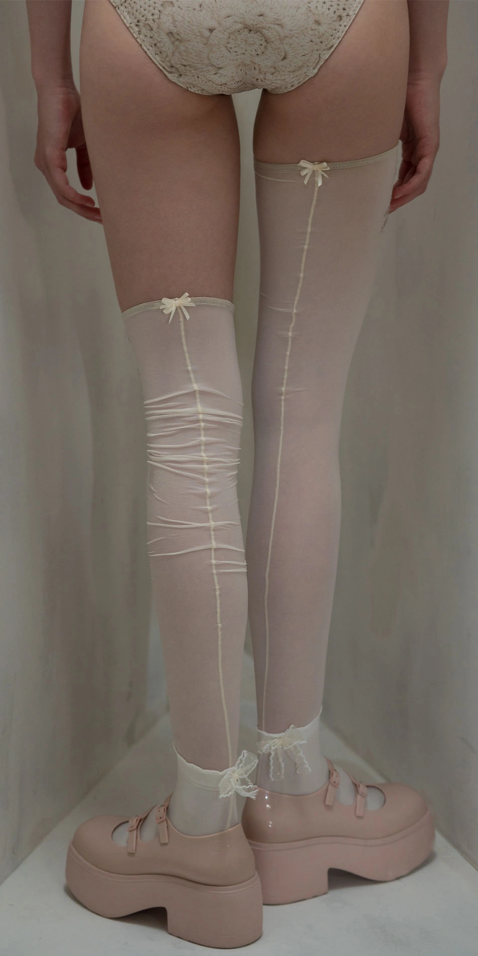 Thigh high stockings rhinestuds in cream back legs up
