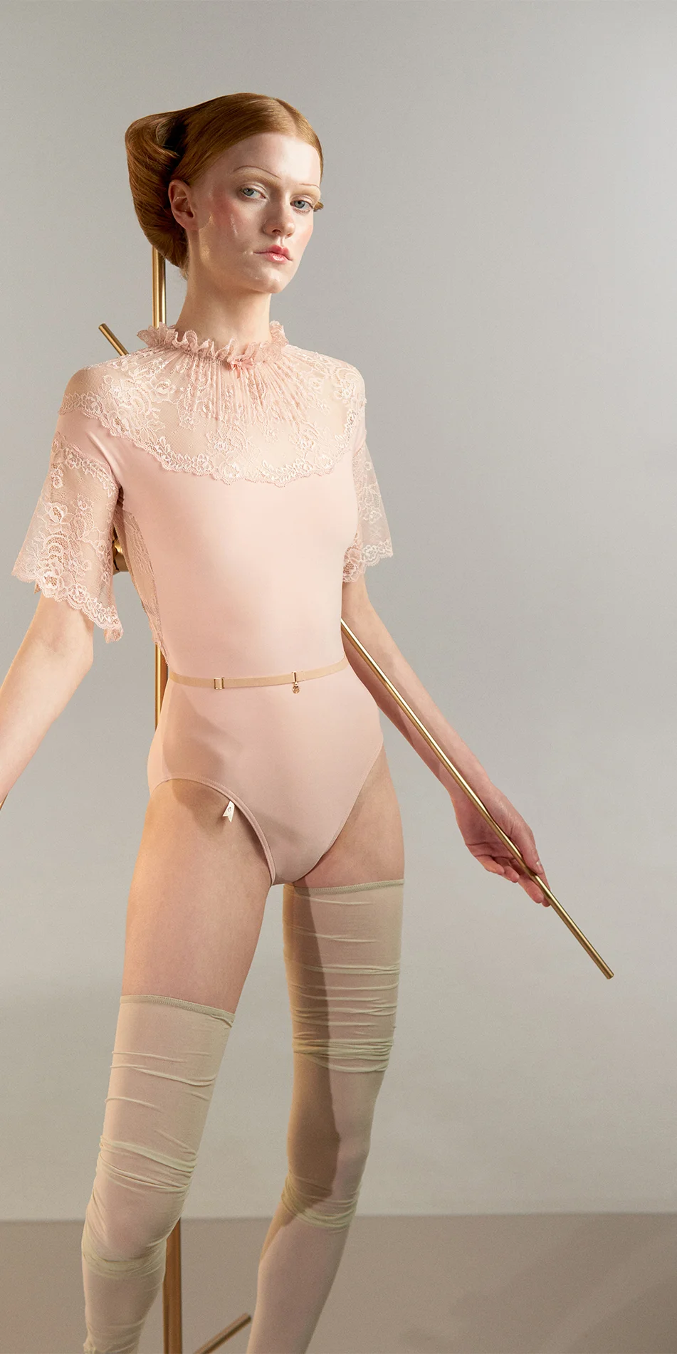 04_Mockneck-leotard-with-bell-sleeves-in-baby-pink-cropped-front-view.webp