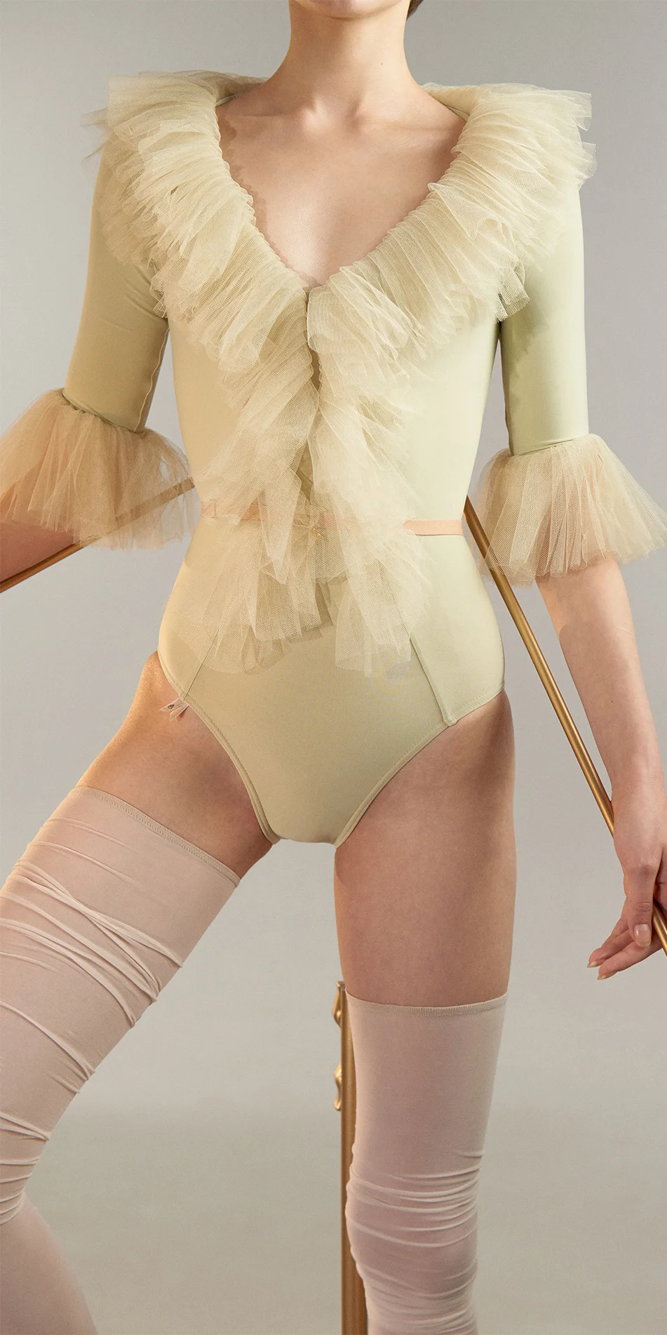 03_Tulle-decollete-leotard-with-sleeves-green-tea-cropped-front-view-detail.webp